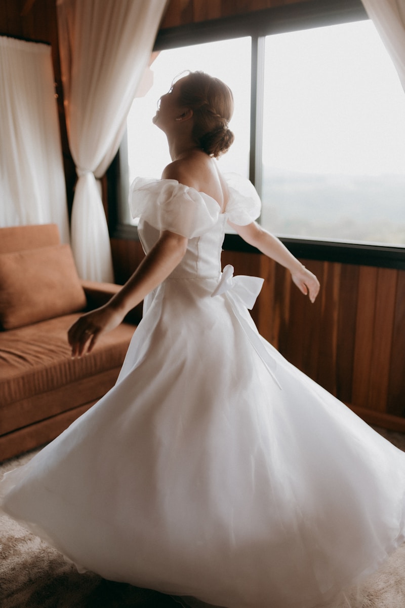Bride twirls in a beautiful, white wedding dress.