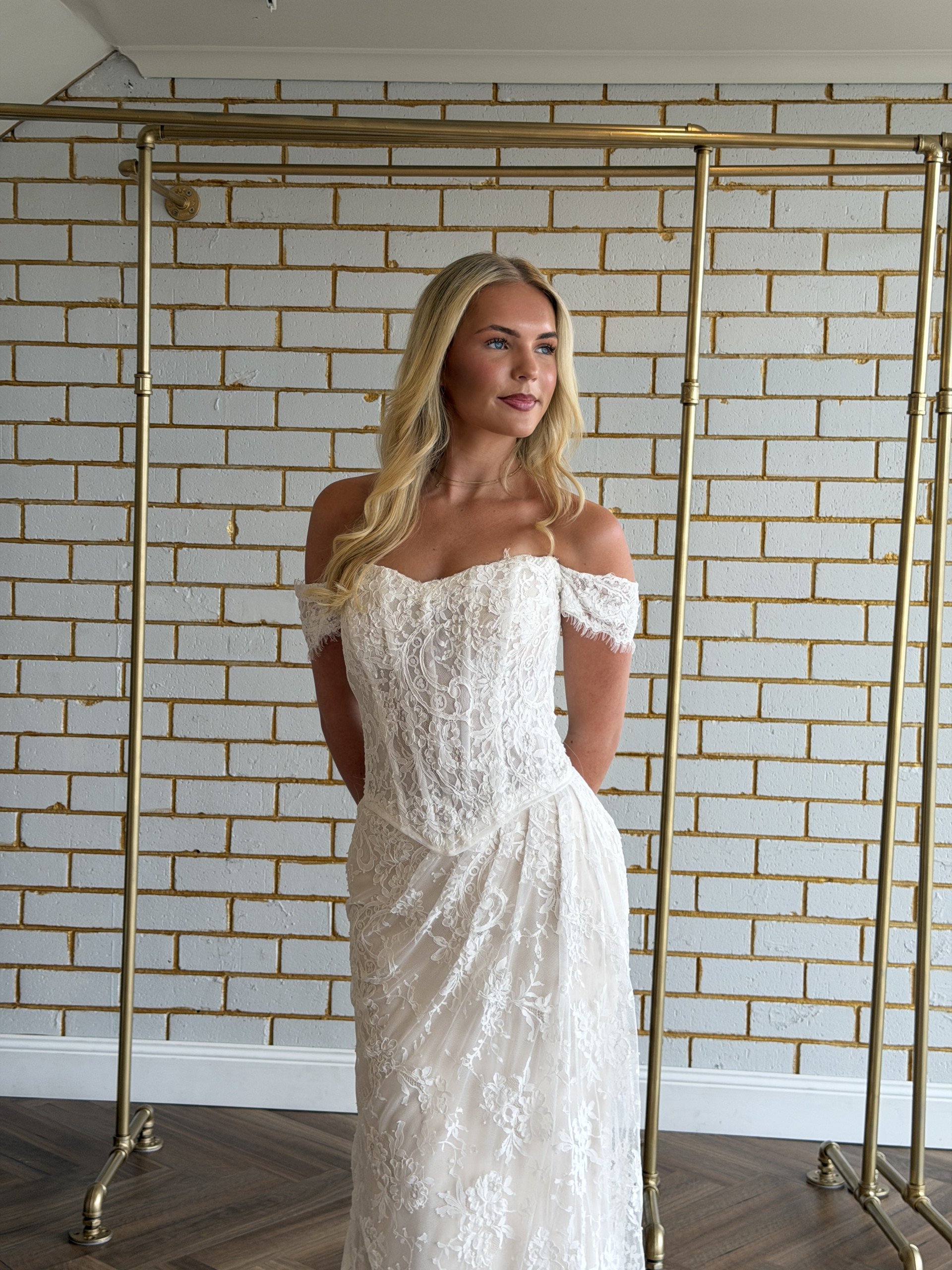 Kendall by Delilah Belle Bridal - fitted lace wedding gown with off-the-shoulder sleeves